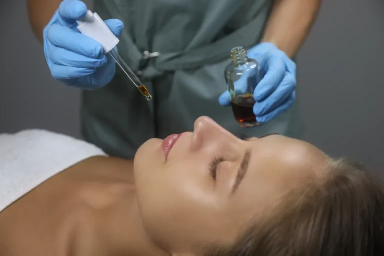 Image with a Lady laying down with a physicians holding a vial