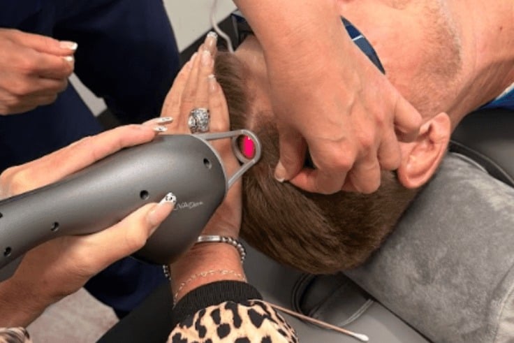 Hair restoration laser treatment being performed at ÉLEVÉ in Lenexa, Kansas